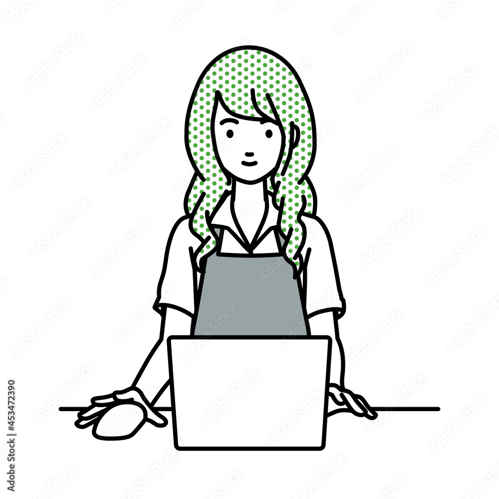 デスクで座ってPCを使っているカフェ店員の女性 デスクで座ってPCを使っているカフェ店員の女性
