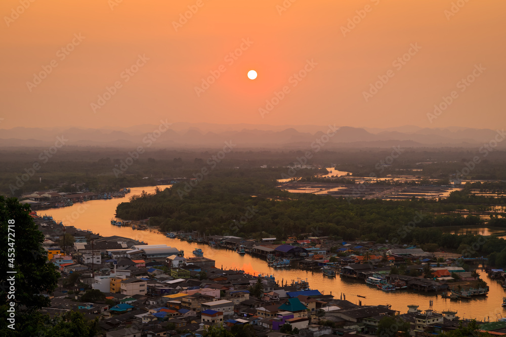 Pak Nam Chumphon town, fisherman village, and river from Khao Matsee scenic viewpoint during sunset, Thailand