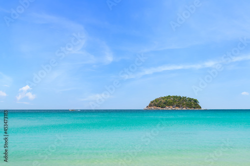 Crystal clear water and island at Kata Beach, famous tourist destination and resort area, Phuket, Thailand