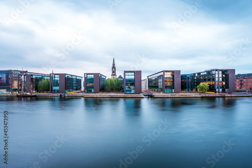 Obraz na płótnie Breathtaking view with modern buildings and church spire on Copenhagen waterfront, Denmark. Exotic amazing places. Popular tourist atraction. w salonie