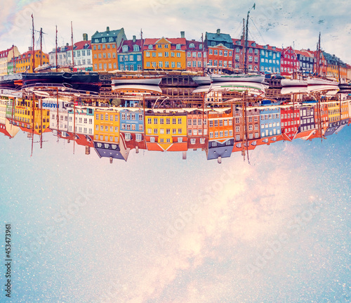 Copenhagen, Denmark – August, 15 magical fascinating landscape with boats in a famous Nyhavn on the background of the stars and the Milky Way in the capital of Denmark Copenhagen.