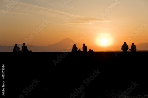 Couples watch Mount Fuji at sunset from Enoshima Island in Kanagawa Prefecture  Japan