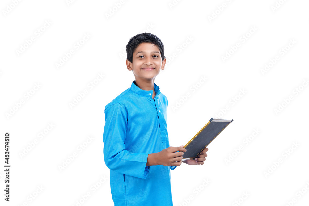 Indian school boy holding chalkboard in hand on white background. Indian school boy holding chalkboard in hand on white background.