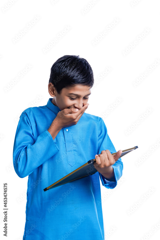 Indian school boy holding chalkboard in hand on white background. Indian school boy holding chalkboard in hand on white background.