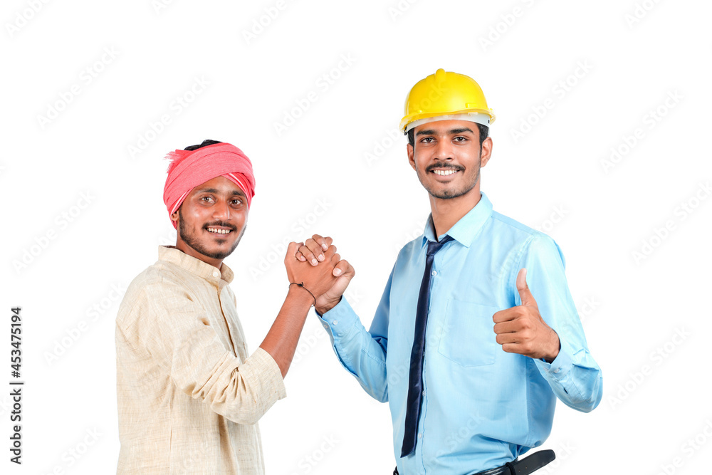 Young indian engineer with farmer on white background. Young indian engineer with farmer on white background.