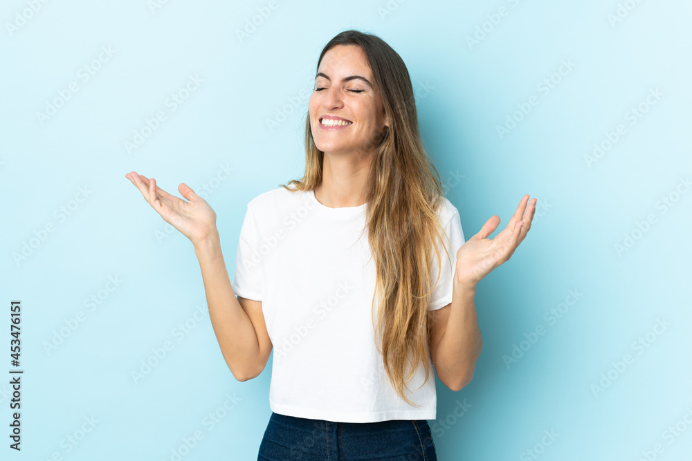 Young caucasian woman over isolated background smiling a lot Young caucasian woman over isolated background smiling a lot