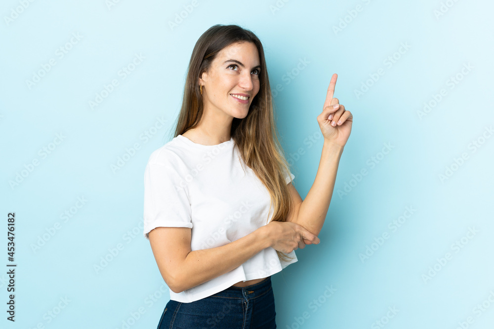 Young caucasian woman over isolated background pointing up a great idea Young caucasian woman over isolated background pointing up a great idea