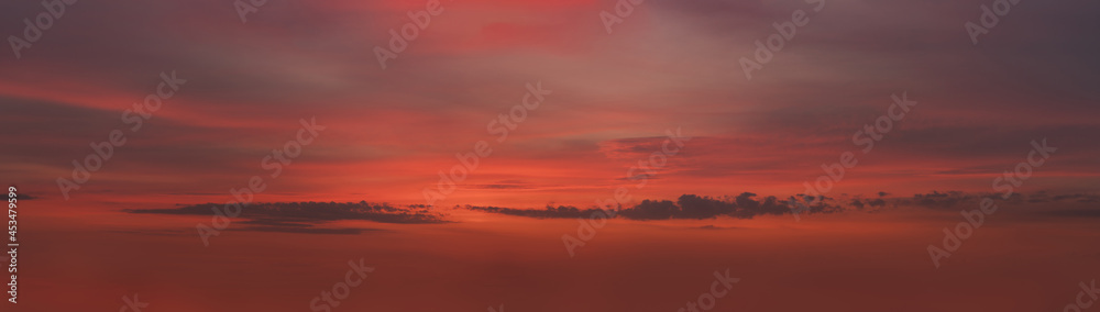 wide panorama of sunset clouds in the sky in summer evening