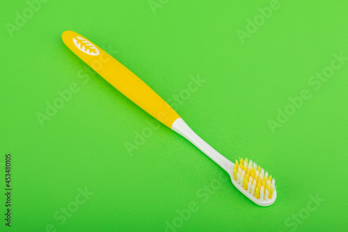 toothbrush on a green background. Oral health. Personal hygiene.