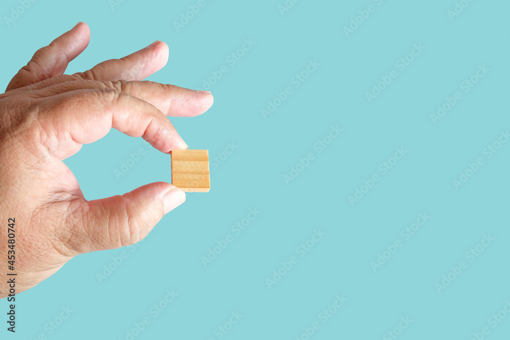 Hand hold a Wood Square or cubes with Copy Space Hand hold a Wood Square or cubes with Copy Space