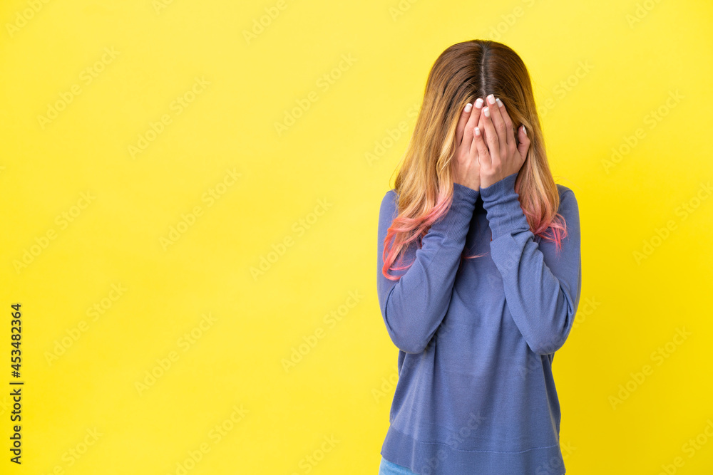 Young woman over isolated yellow background with tired and sick expression Young woman over isolated yellow background with tired and sick expression