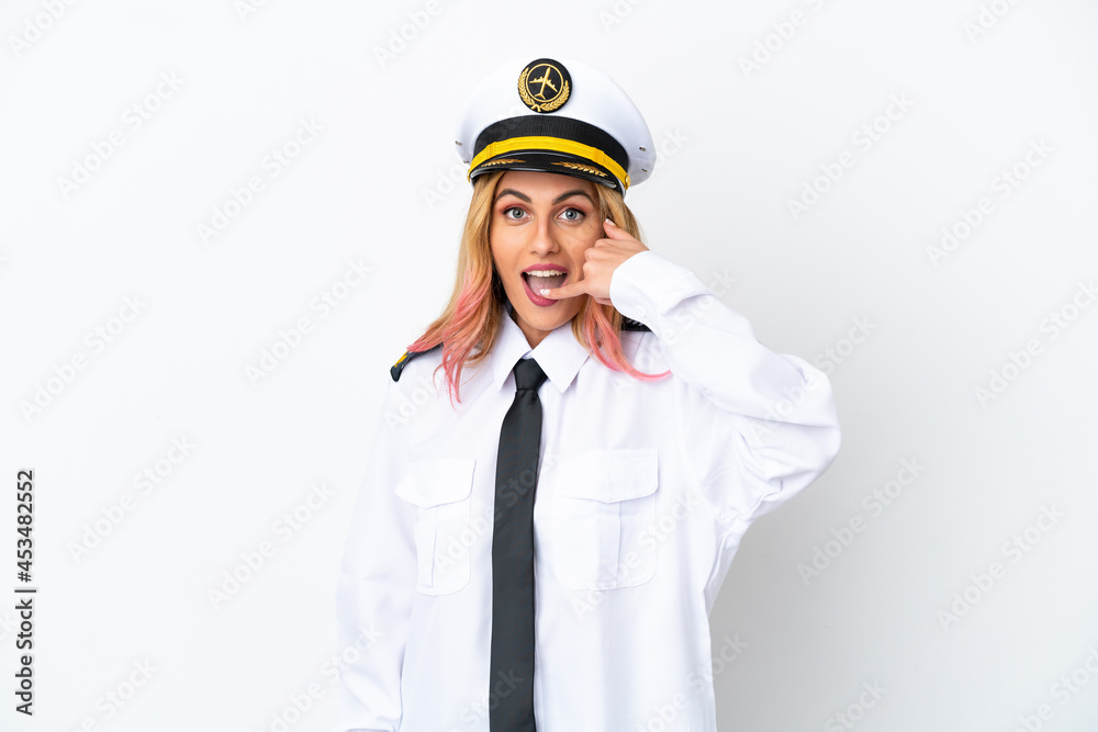 Airplane pilot over isolated white background making phone gesture. Call me back sign Airplane pilot over isolated white background making phone gesture. Call me back sign