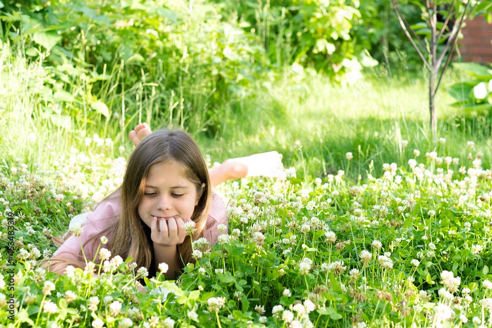 Cute Smiling Girl Reading Book and Resting Park .Summer and homeschooling concept Cute Smiling Girl Reading Book and Resting Park .Summer and homeschooling concept