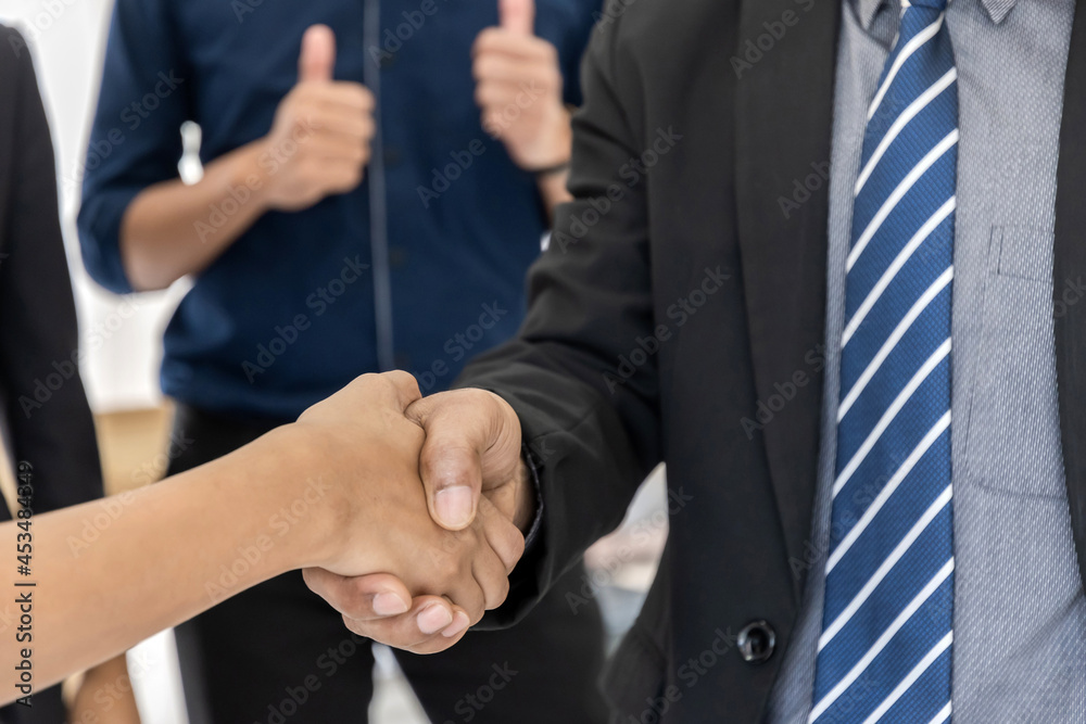 Obraz premium group of business people partnership handshaking after good deal in meeting room at office, congratulation on promotion, partnership, partner, teamwork, community, connection and handshake concept