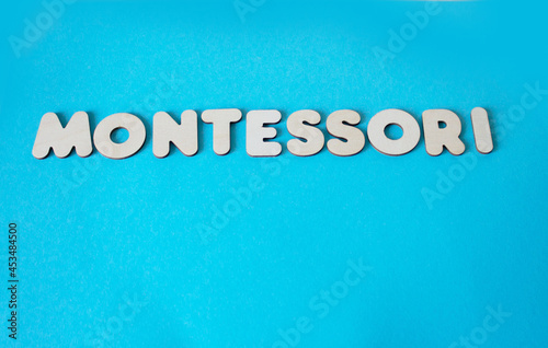 montessori logo on a blue background