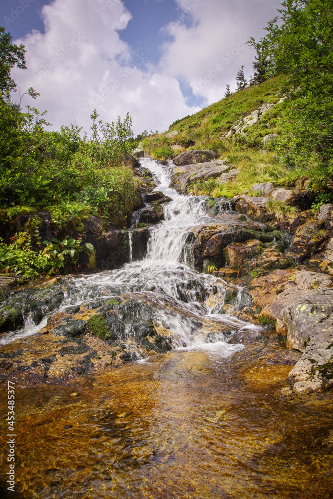Riverhead of Elbe river in Giant mountains and coats of arms of towns along this river, national park Krkonose in the Czech Republic Riverhead of Elbe river in Giant mountains and coats of arms of towns along this river, national park Krkonose in the Czech Republic