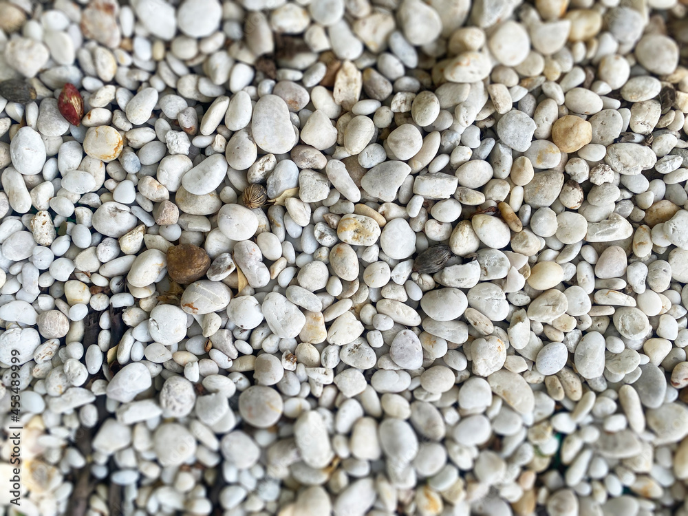 White pebble stone texture rough, blur background gray-white tone. Use this for wallpaper or background image. There is a blank space for text.