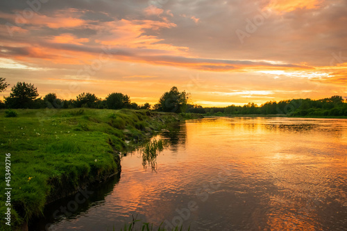 Lower Narew Valley, sunset on the Narew River, Łomża, Poland photo