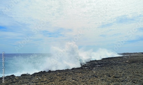 Powerful waves hitting the rugged shoreline along Watamula, huge waves burst into the sky with gunfire like explosions, Westpunt, Curacao