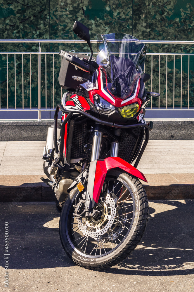Motorcycle Honda CRF1100L with dual-clutch transmission ion the city  parking. Front view of motorbike parked on city road Stock Photo | Adobe  Stock