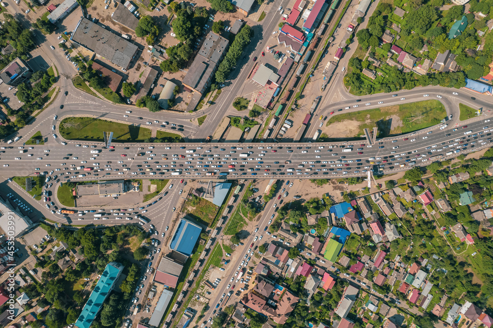 Transport Aerials - top down view of freeway busy city rush hour heavy traffic jam highway.