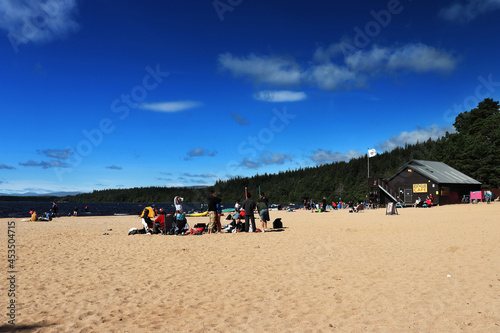 people on the loch morlich beach photo