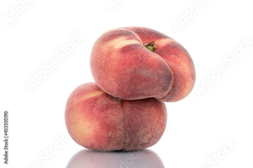 Two juicy organic peaches, close-up, isolated on white. © Oleksandr