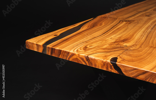 Slab, saw cut wood treated with varnish close-up on a black background. Isolate. 