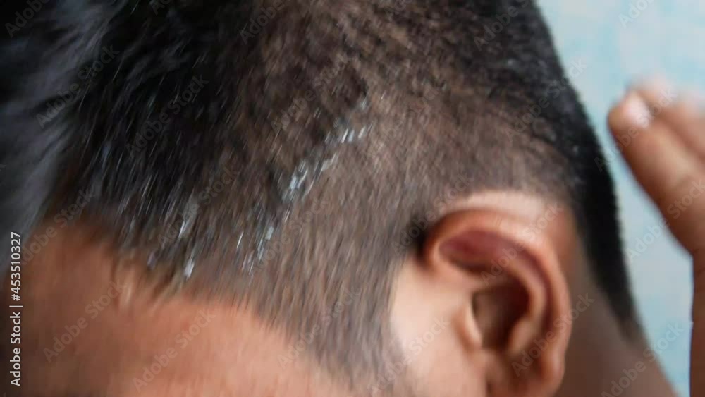 young man applying hair gel close up young man applying hair gel close up