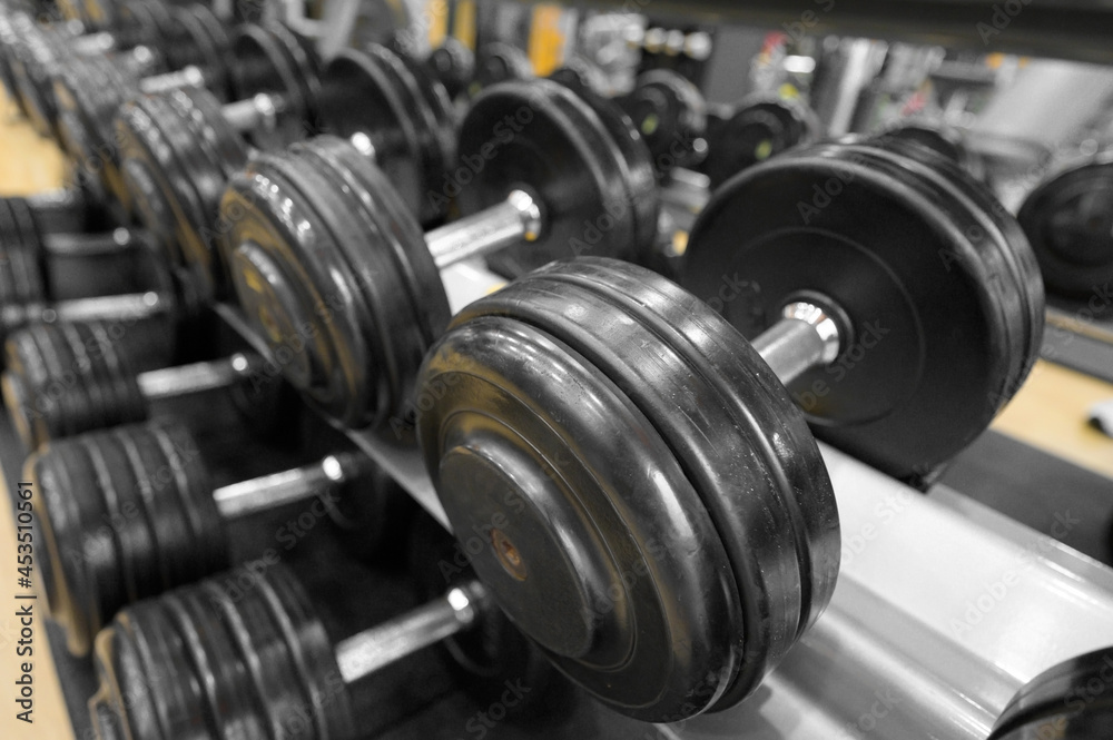 Close up of dumbbells. Gym interior. High quality photo Close up of dumbbells. Gym interior. High quality photo