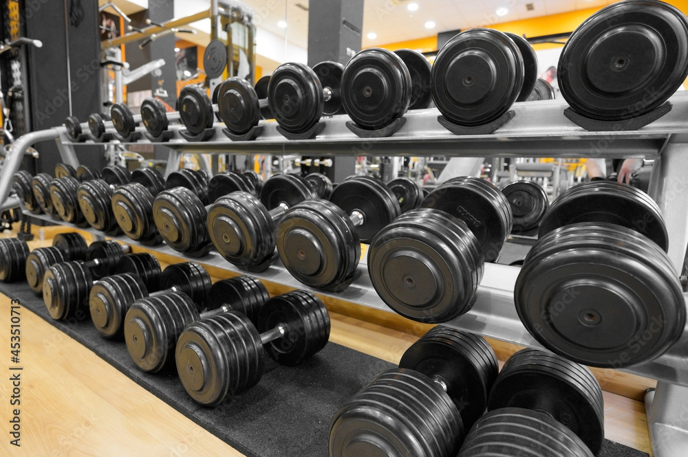 Close up of dumbbells. Gym interior. High quality photo Close up of dumbbells. Gym interior. High quality photo