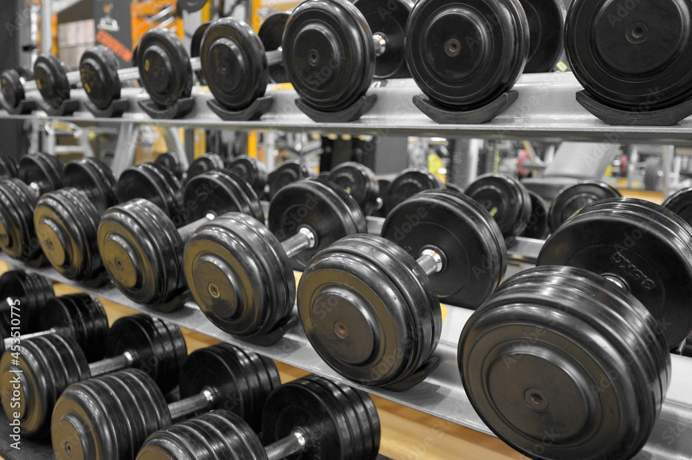 Close up of dumbbells. Gym interior. High quality photo Close up of dumbbells. Gym interior. High quality photo