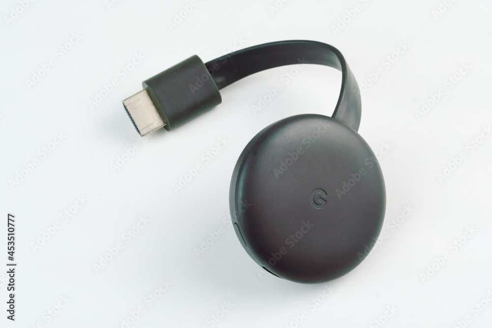 Google Chromecast 3rd generation close-up isolated on white background.  Selective focus. Top view. Rio de Janeiro, RJ, Brazil. May 2021. Stock-Foto  | Adobe Stock