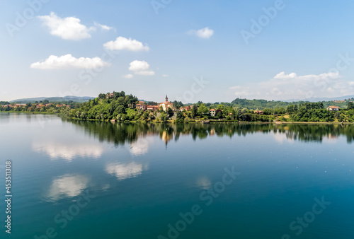 Landscape of Lake Varese with view to the church of San Lorenzo of Biandronno, Italy