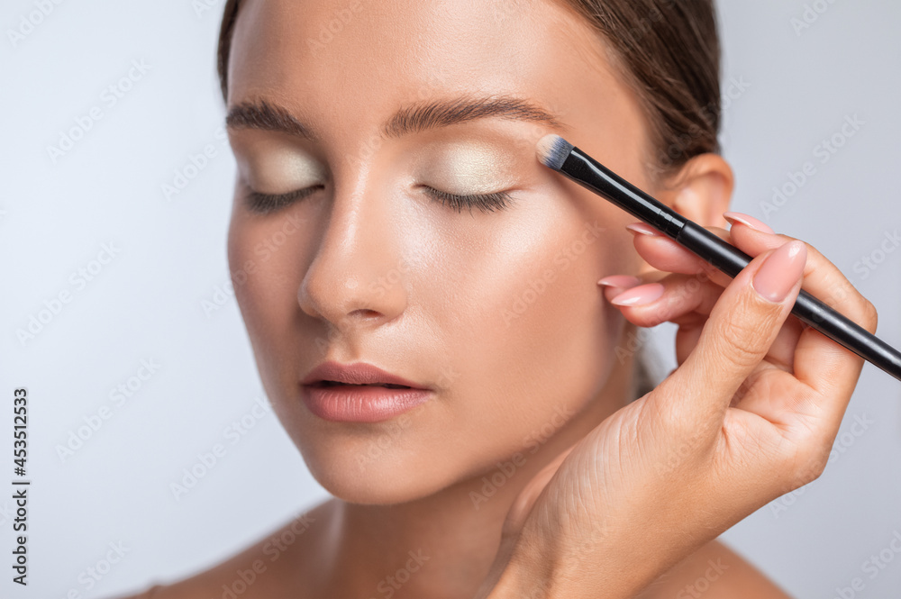 Beautiful woman with long eyelashes, beautiful make-up and thick eyebrows. Professional makeup and cosmetology skin care. Beautiful woman with long eyelashes, beautiful make-up and thick eyebrows. Professional makeup and cosmetology skin care.