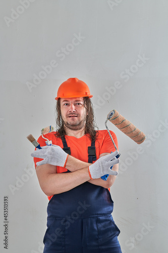 serious repairman with tools to repair the apartment