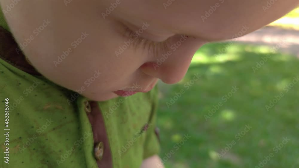 Little boy eating ice cream outdoors closeup Little boy eating ice cream outdoors closeup