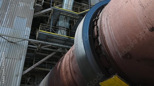 Close up of rotary kiln for clinker production in cement plant 4K. photo