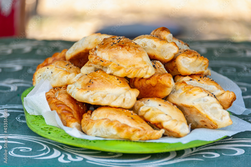 Baked pies on the table in a plate. Baked pies on the table in a plate.