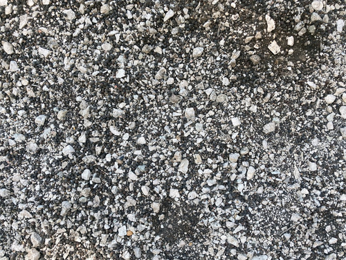 fine gravel over brown soil background