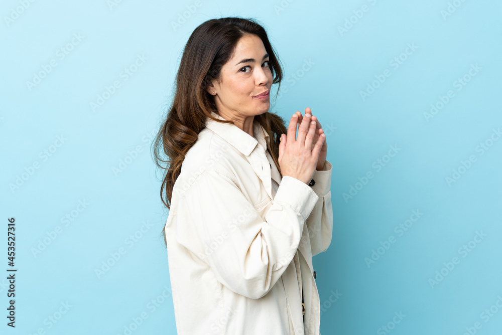 Woman over isolated background scheming something Woman over isolated background scheming something