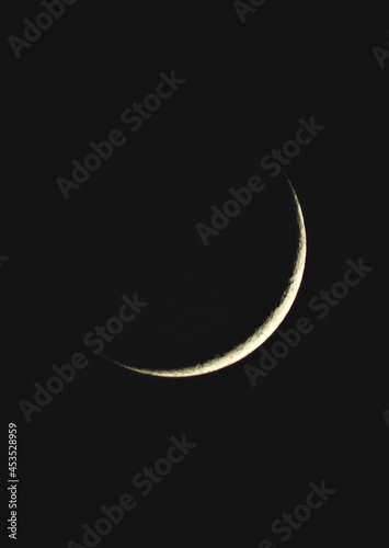 Crescent moon in the dark night in algeria 