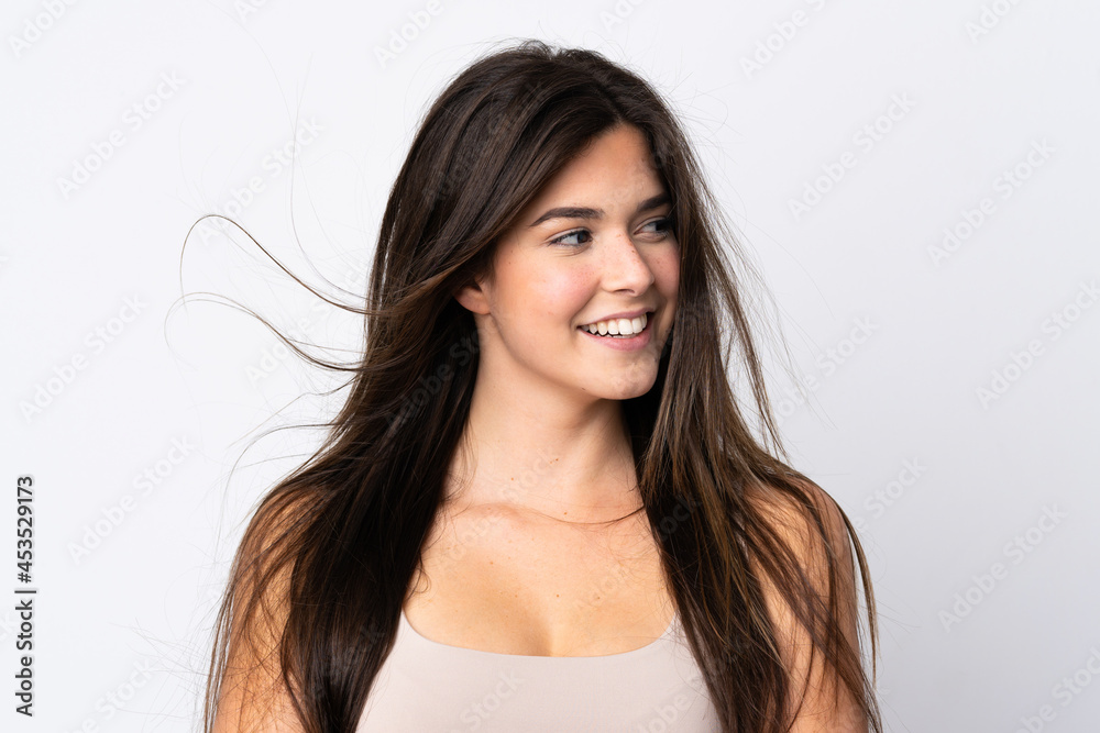 Teenager Brazilian girl over isolated background Teenager Brazilian girl over isolated background