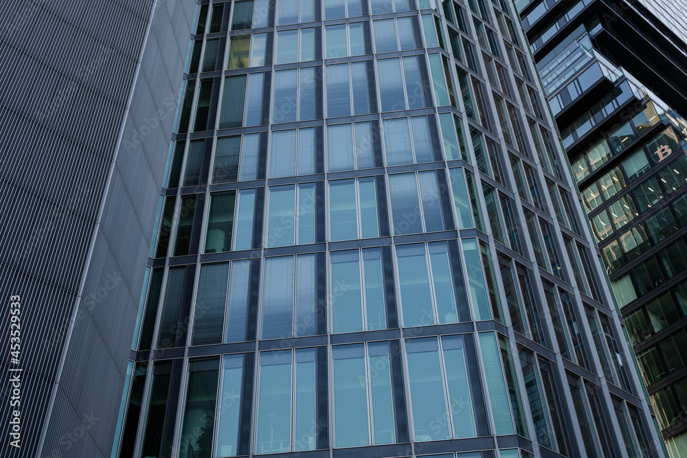 Exterior architectural detail modern facade of High-rise office buildings. Abstract Urban metropolis background.