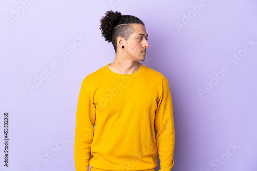 Caucasian man over isolated background looking to the side