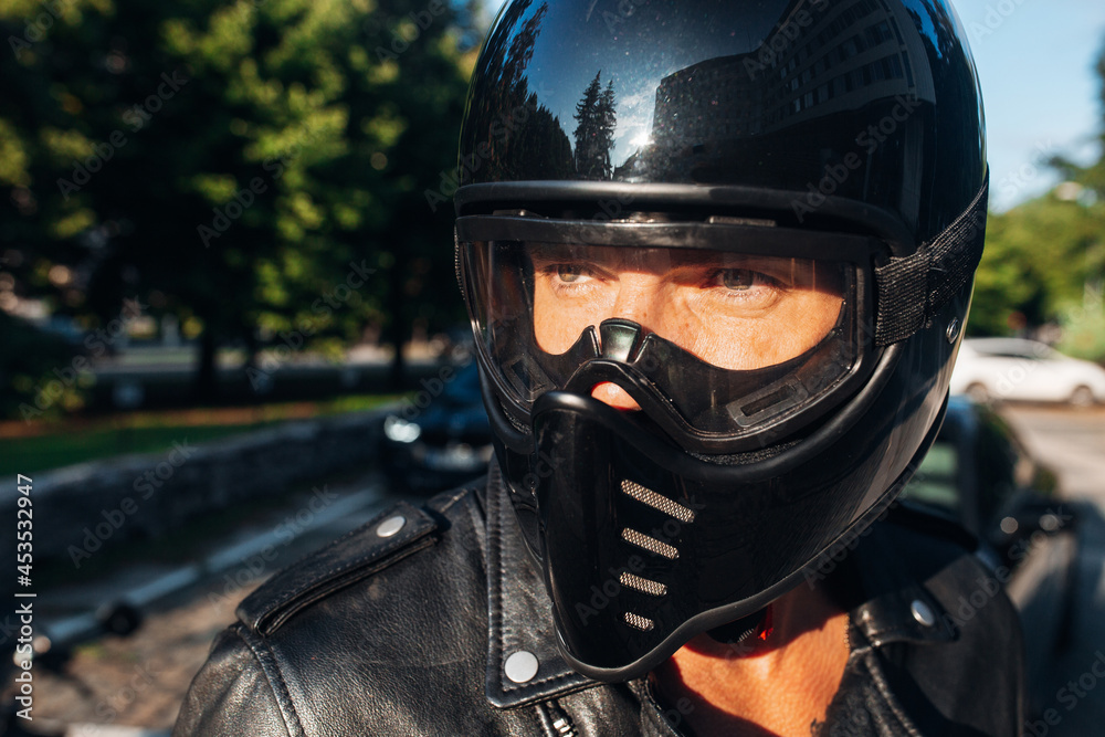 Biker man portrait in a motorcycle helmet Biker man portrait in a motorcycle helmet