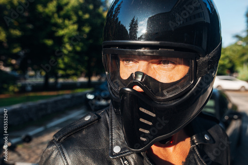 Biker man portrait in a motorcycle helmet © Moose