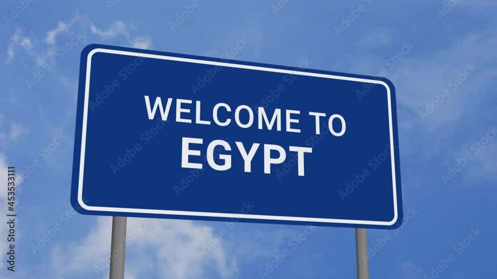 Welcome to Egypt Road Sign on Clear Blue Sky with Rapid Moving Clouds Welcome to Egypt Road Sign on Clear Blue Sky with Rapid Moving Clouds