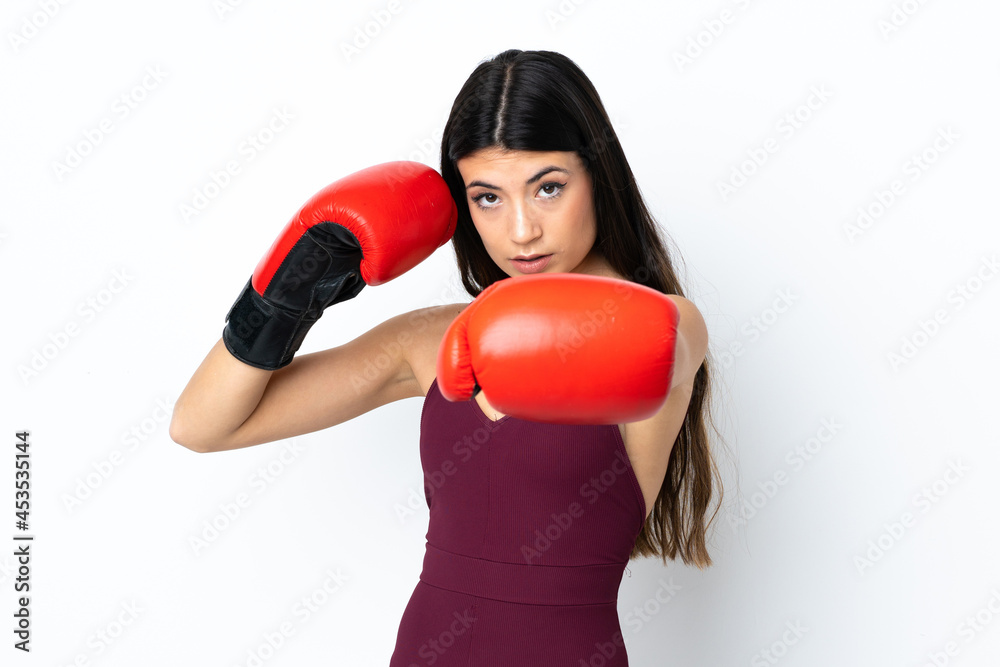 Young sport woman over isolated white background with boxing gloves Young sport woman over isolated white background with boxing gloves