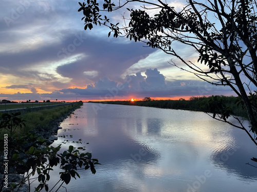 Swamp sunset and hurricane clouds